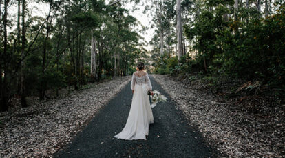 Bride walking through RAC Karri Valley forest location