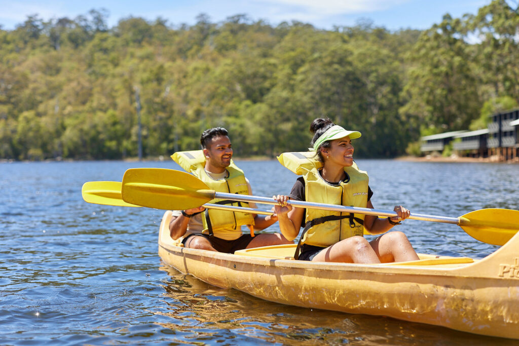 Young couple in a two-person canoe on Lake Beedelup