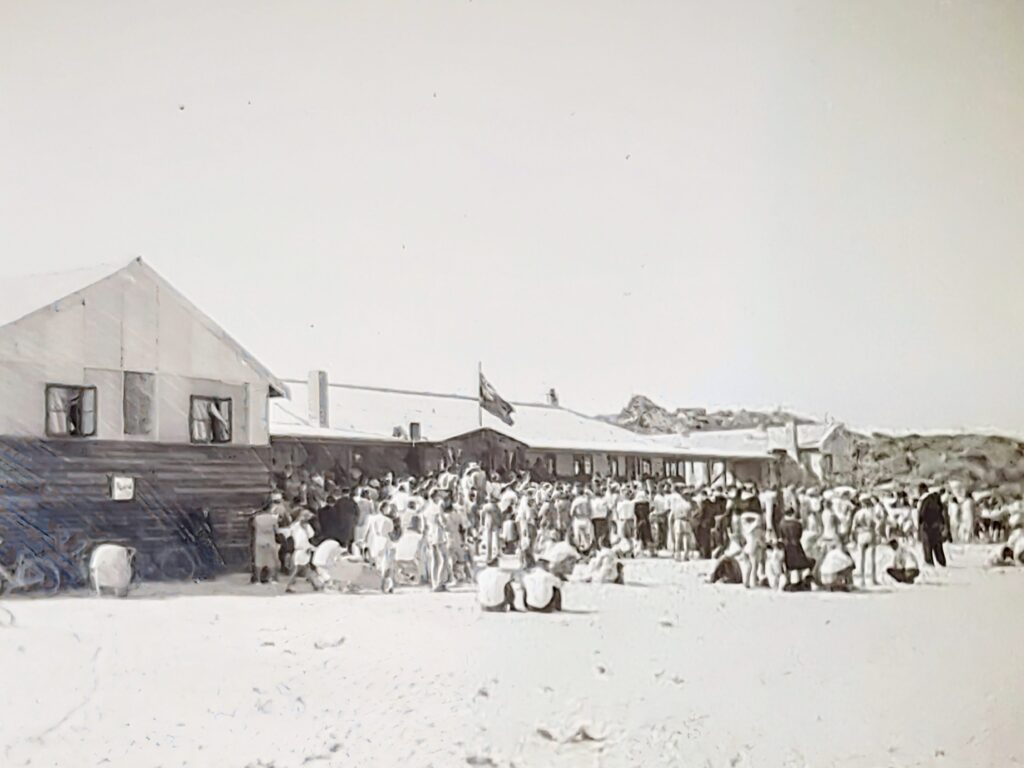 Old black and white image of Fresh Air League building and crowd in front of it