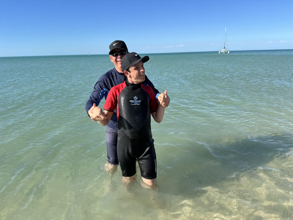 Wheelchair user and guest at RAC Monkey Mia Dolphin Resort, Braeden, enjoying a swim.