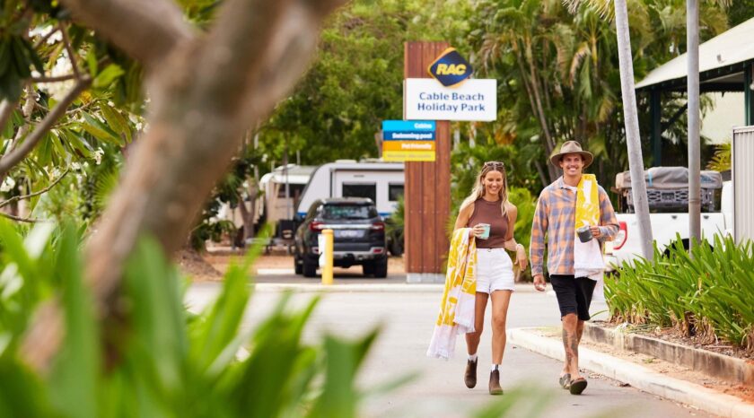 Couple walking to the beach from RAC Cable Beach Holiday Park.