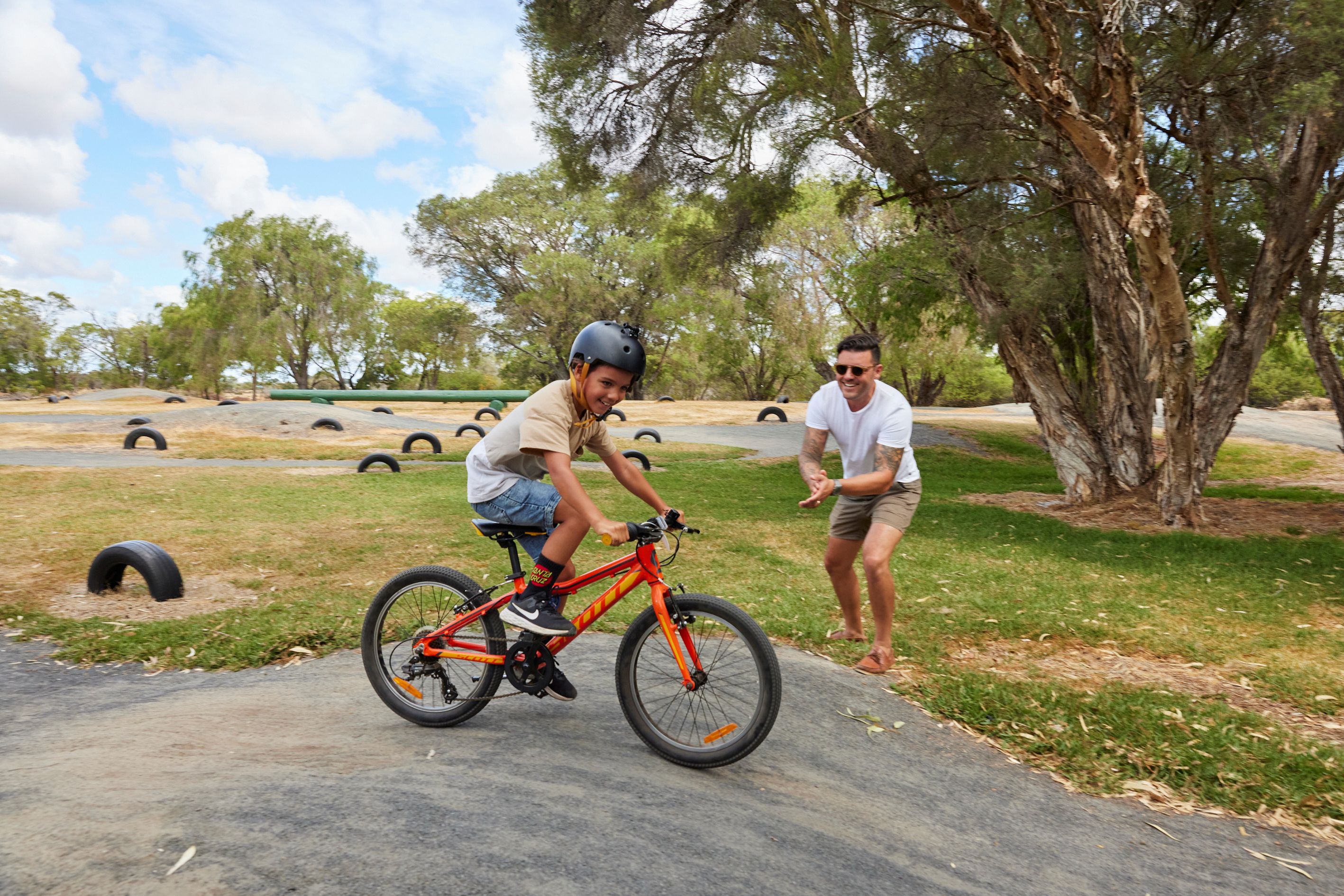 Parent cheering on their son at the RAC Busselton Holiday Park BMX track