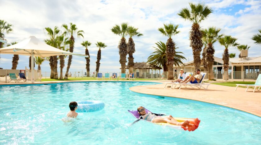 Family relaxing on pool toys in the RAC Monkey Mia Dolphin Resort pool