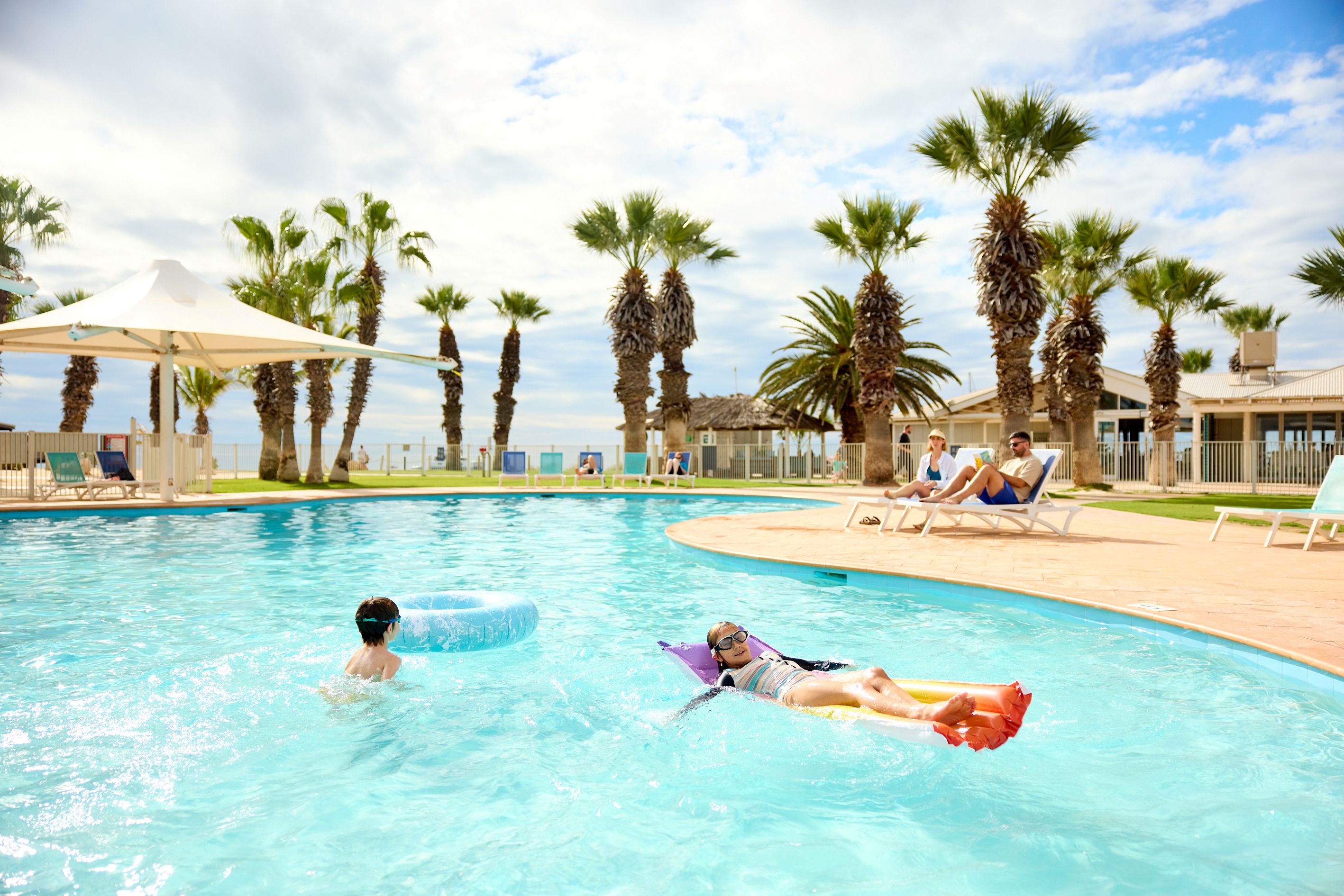 Father and daughter enjoying a swim together in our Busselton pool. 