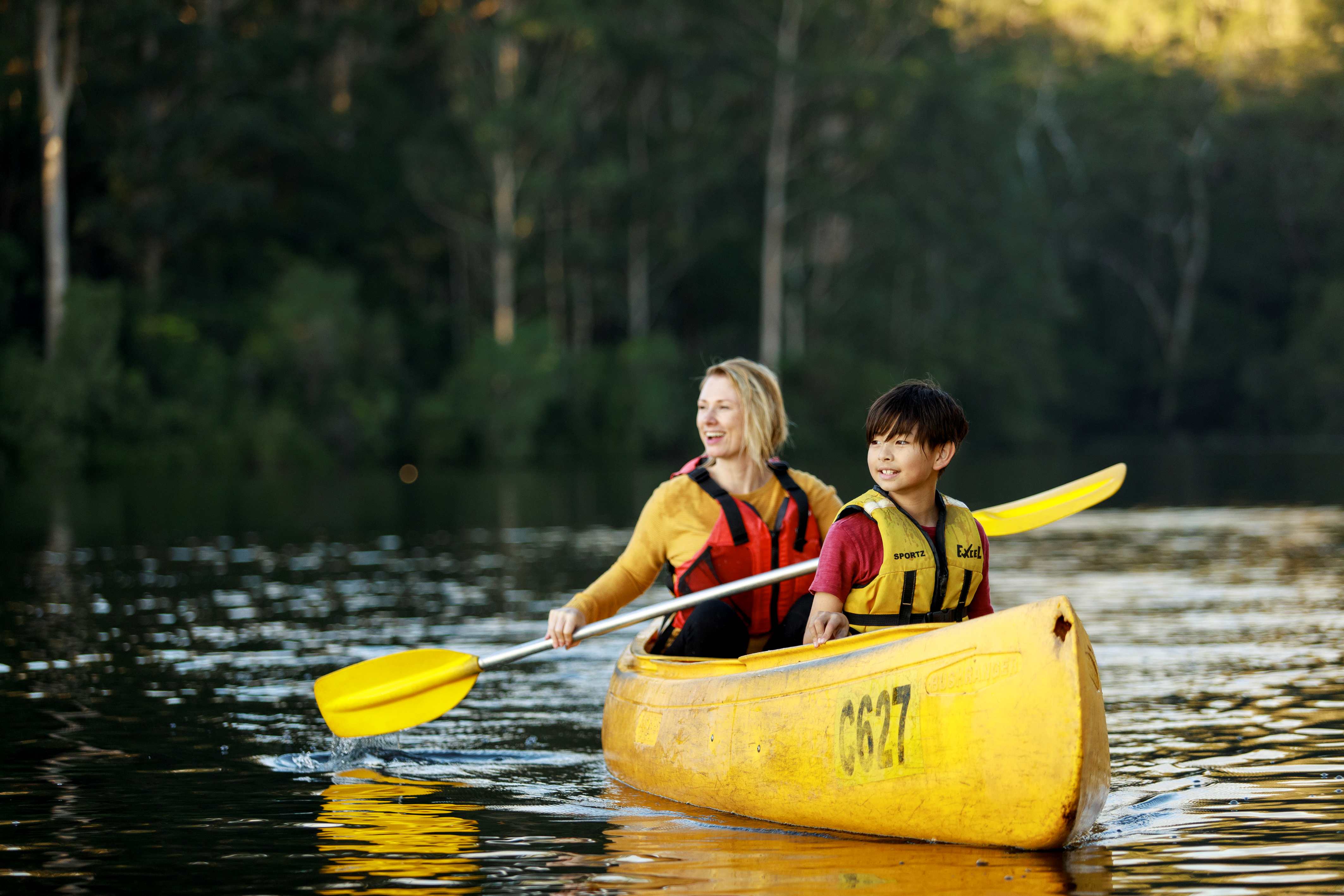 Parent and son kayaking at RAC Karri Valley Resort.