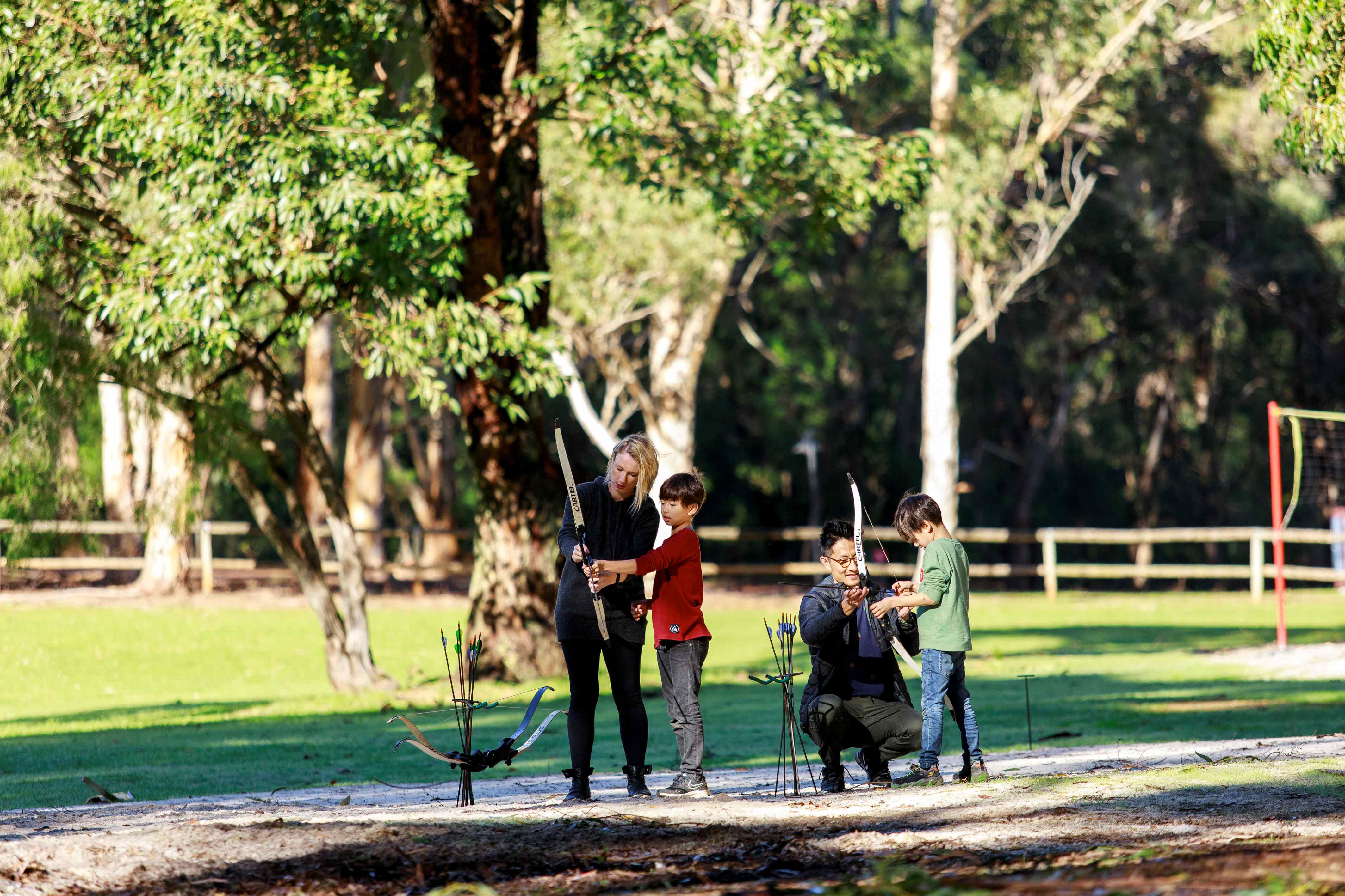 Family playing archery at RAC Karri Valley Resort.